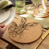 Circular cork place mat with detailed black ink rabbit illustration made from portuguese cork perfect as place mats