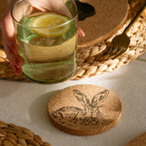 Round portuguese cork coaster with a detailed black etched rabbit design, heat resistant and perfect for cups
