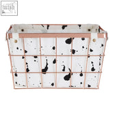 Harga rose gold iron wireframe basket with white fabric liner featuring black splatter effect for stylish storage