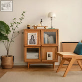 Light wood mid-century modern harriet sideboard with glass-paneled doors and tapered legs solid wood bedside table