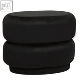 Black velvet oval pouffe with modern stacked circular design perfect for stylish seating or footrest