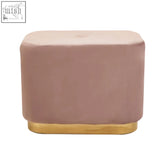 A sleek dusty pink velvet ottoman with a matte gold rectangular polished base perfect for stylish seating