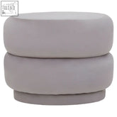 A sleek hartford mink velvet oval pouffe in soft gray with rounded stacked tiers and plush mink velvet upholstery