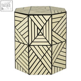 Octagonal hassa ivory resin geometric stool with black resin geometric lines on textured off-white surface