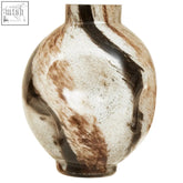 A round glossy ceramic glass vase with brushstroke design small swirling brown and black patterns on a metallic base