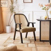 Dark wood framed hellen rattan dining chair with woven cane back and cotton linen olive seat upholstery