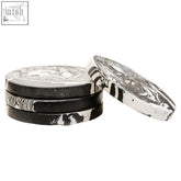 Helsa set of four black and white marble coasters with zebra print and silver embossed design on four round coasters