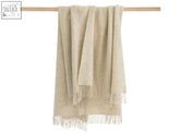 Beige herringbone natural undyed pure wool throw with soft fringed edges perfect for cozying up
