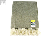 Olive green herringbone pure new wool blanket with cream fringe and branded label for cozy warmth