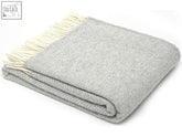 A soft silver grey pure new wool herringbone throw with cream fringe 183cm including fringe perfect for a double bed