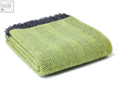 Folded zest charcoal herringbone pure new wool throw blanket with dark gray fringe and cozy texture