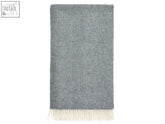 A soft heathered gray herringbone pattern wool throw with cream fringe from the herringbone shetland pure new wool throw teal collection