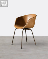 Tan leather herron dining chair with sleek modern design and slender metal legs perfect for dining areas