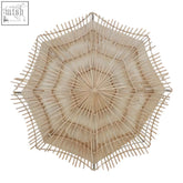 Beige large rattan woven wall light with a radial geometric pattern perfect as a rattan woven wall accent