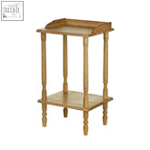 Light oak two-tier side table with turned legs and curved top edge made from tropical hevea wood