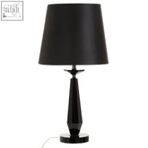 Black matte Hexum table lamp with a sleek faceted base and drum shade made of black crystal glass for any glass table lamp setup