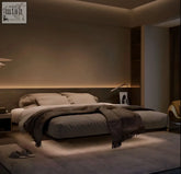 Modern minimalist hidemi bed with sleek solid ash wood headboard upholstered in neutral fabric with gray throws