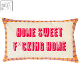Cream-colored needlepoint home sweet f*cking home cushion with bold red text and orange purple plaid border