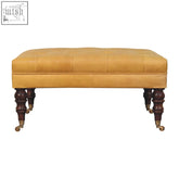 Honey caramel buffalo tan leather ottoman bench with tufted top castor legs and dark wood frame, no ash black leather appearance
