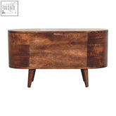A sleek honey caramel wooden blanket box with rounded lid and rich brown finish showing natural wood grain patterns