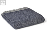 A folded navy grey honeycomb xl pure new wool throw blanket with herringbone pattern and fringed edge size guide