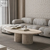 Stone oval honin coffee table with two cylindrical stone legs perfect for stylish living room setups