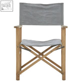 Gray linen directors chair with light wood frame featuring a grey linen canvas folding seat for easy portability