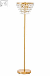 Gold-toned hutchinson clear crystal floor lamp with tiered crystal chandelier design and gold metal frame