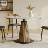 Ichiro dining table with round tabletop white marble top fluted wooden base in warm oak and black metal pedestal