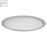 Ida embossed glass coupe dinner plate with silver rim and silver-toned circular tray featuring ridged patterns