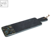 Imogen large black slate paddle board with paua shell mosaic inlay along one edge on black slate surface