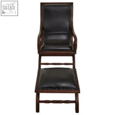 Dark brown genuine black leather lounge chair with matching footstool featuring teak frame and nailhead trim