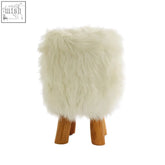 White faux fur round footstool with wooden legs in a cube shape perfect as a fur round footstool seat