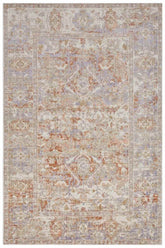 Vintage-inspired indoor outdoor port said rug with distressed medallion pattern in beige lavender and rust tones