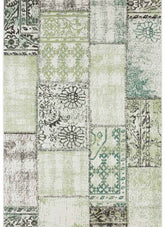 Indoor outdoor symi patchwork rug with vintage distressed look and muted green beige ornate patterns