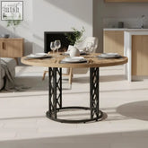 Industrial round dining table with rustic light wood top and black metal x-frame pedestal legs for dining room