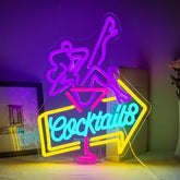 A vibrant led cocktail neon sign with glowing blue letters and purple yellow outlines for home bar decor