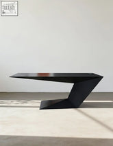 Black wood ines modern office desk with matte finish and angular geometric design for a sleek modern office desk setup