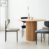 Ivar round dining round wooden table with vertical slats and minimalist design in natural wood finish