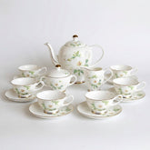 Ivory camellia tea set with 15 pieces of white porcelain featuring delicate floral patterns and gold trim for 6 people