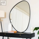 Black metal izumi mirror with irregular shape and sleek minimalist frame measuring 120cm by 90cm