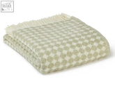 A soft cream and sage green jacquard spot wool throw with fringed edge perfect for cozy blanket size guide