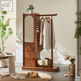A warm-toned wooden jessica rattan wardrobe with cane panel door, three drawers, and hanging clothes inside