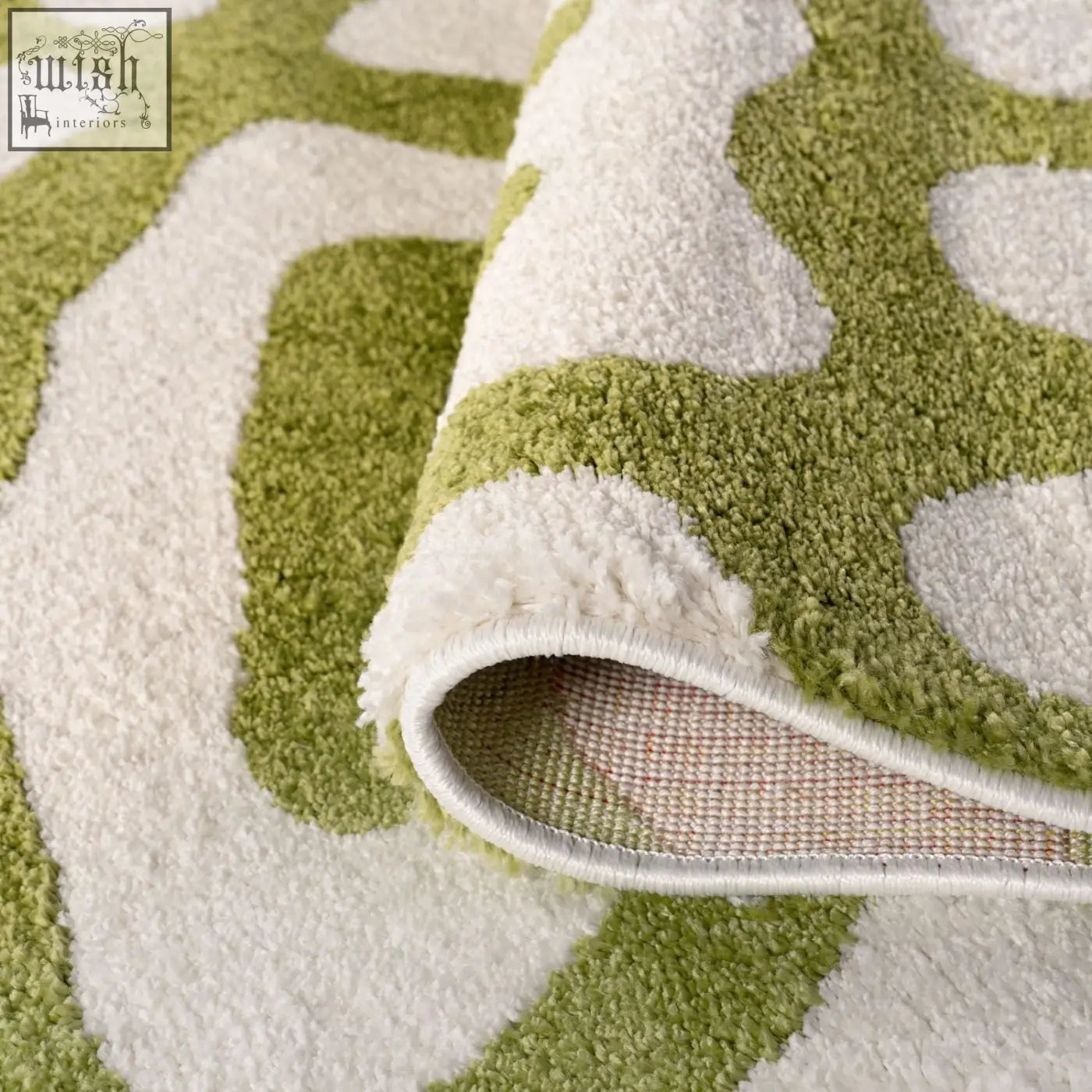 A joli doodle green plush area rug with a soft textured surface and modern olive green and cream abstract pattern