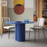 Vibrant blue julia round dining table with a fluted pedestal base perfect for stylish round dining spaces