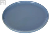 A smooth solid blue ceramic juna blue dessert plate with a glossy finish and slightly raised rim