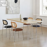Modern kamaria dining table with solid wood light wood top and transparent acrylic legs for stylish dining areas