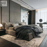 Modern gray kamoto bed with plush upholstery and a sturdy frame featuring sleek minimalist design and matching bedding