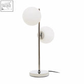 Modern chrome table lamp with karter white glass featuring two frosted white spherical shades for stylish lighting