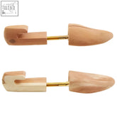 Light brown kata cedar wooden shoe shapers with smooth polished finish and gold metal shafts made of aromatic cedar wood